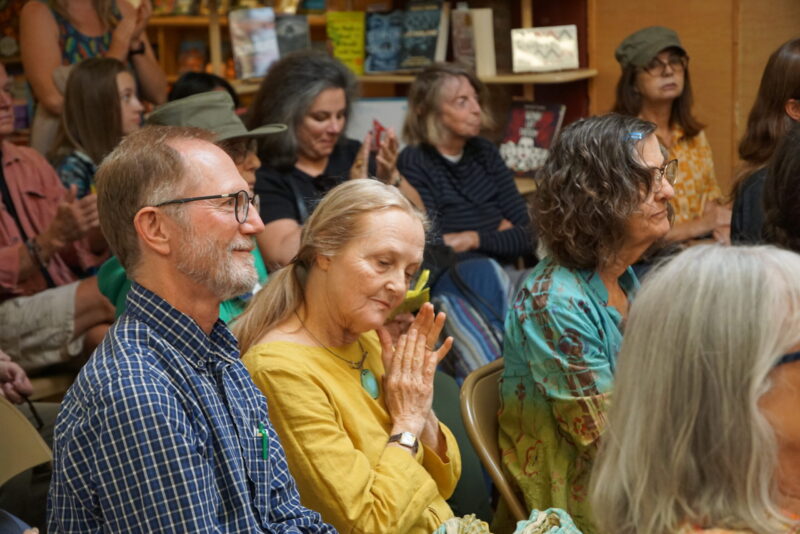 Gwynn O'Gara and John Johnson enjoy the poetry of Lee Herrick at Copperfields. Photo by Jimmy Johnson.