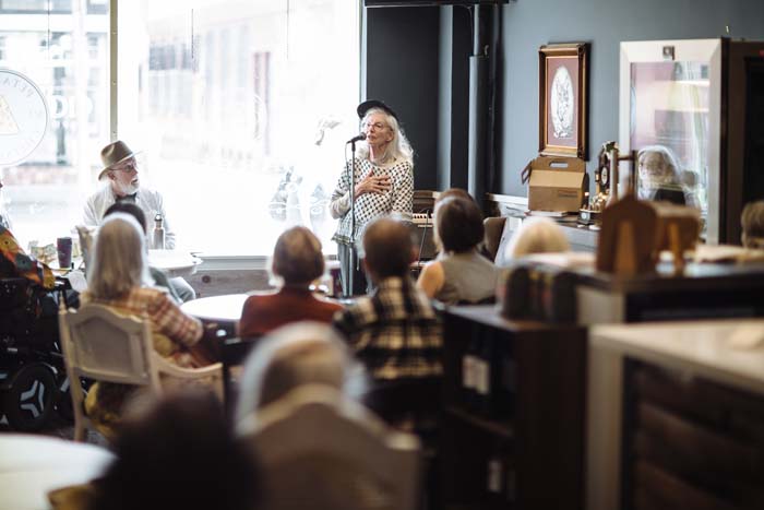 Lynn Watson reads at the Petaluma Cheese Shop. Photo by Michael Woolsey.