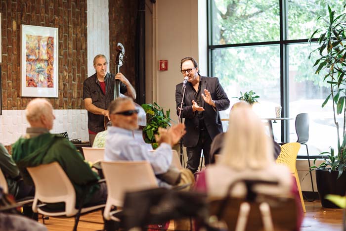 Daedalus Howell introduces poets at Keller CoWork. Photo by Michael Woolsey.