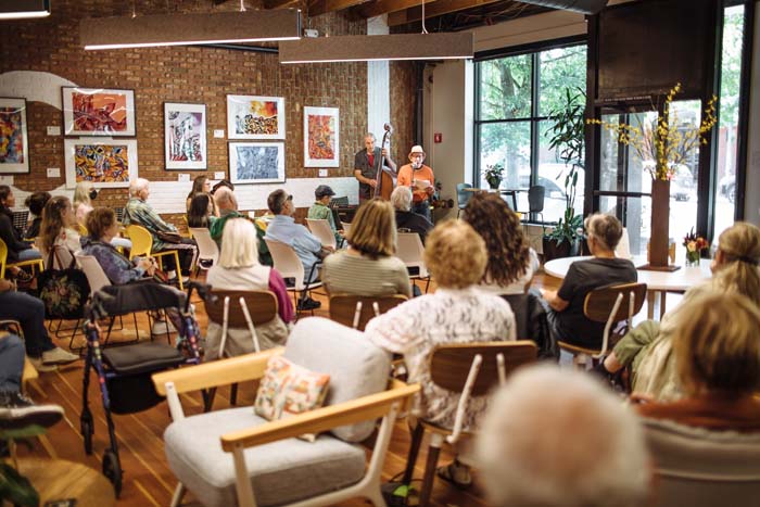 Jonah Raskin reads to a crowd at Keller CoWork. Photo by Michael Woolsey.