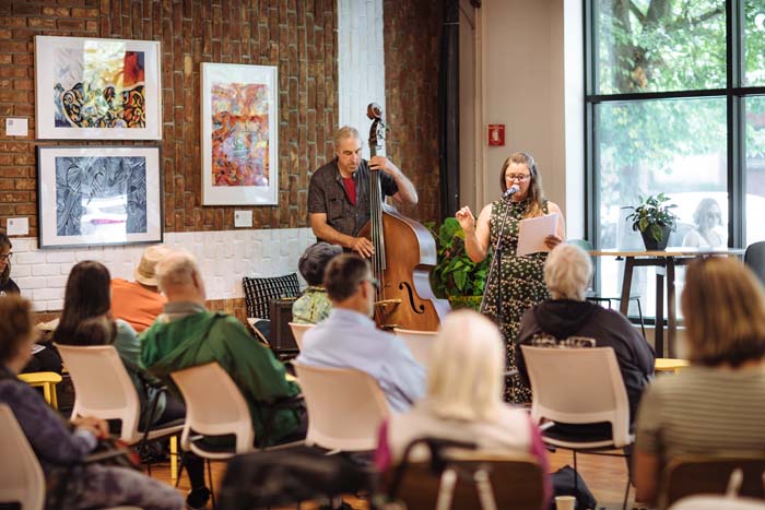 Steve Shain accompanies poet Stacey Tuel. Photo by Michael Woolsey.