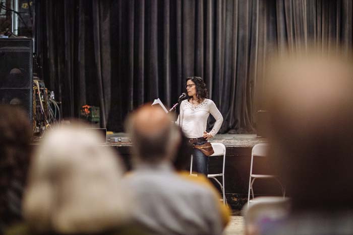 Nancy Miller Gomez reads at the Phoenix Theater. Photo by Michael Woolsey.