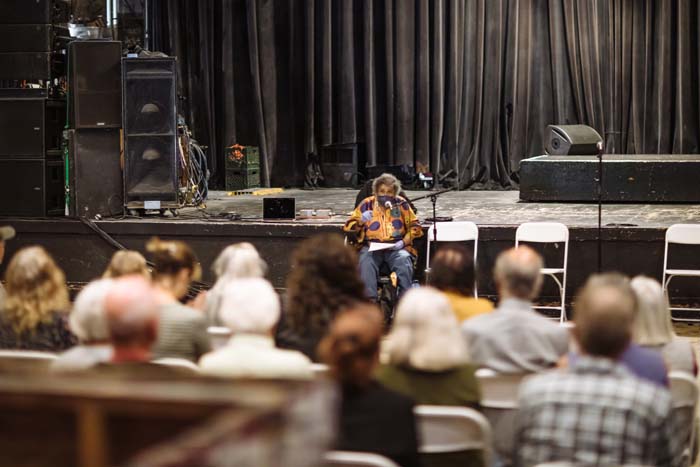 Avotcja reads at the Phoenix Theater. Photo by Michael Woolsey.